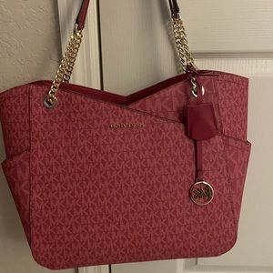 Michael Kors Jet Set Tote Bag in Berry color.
